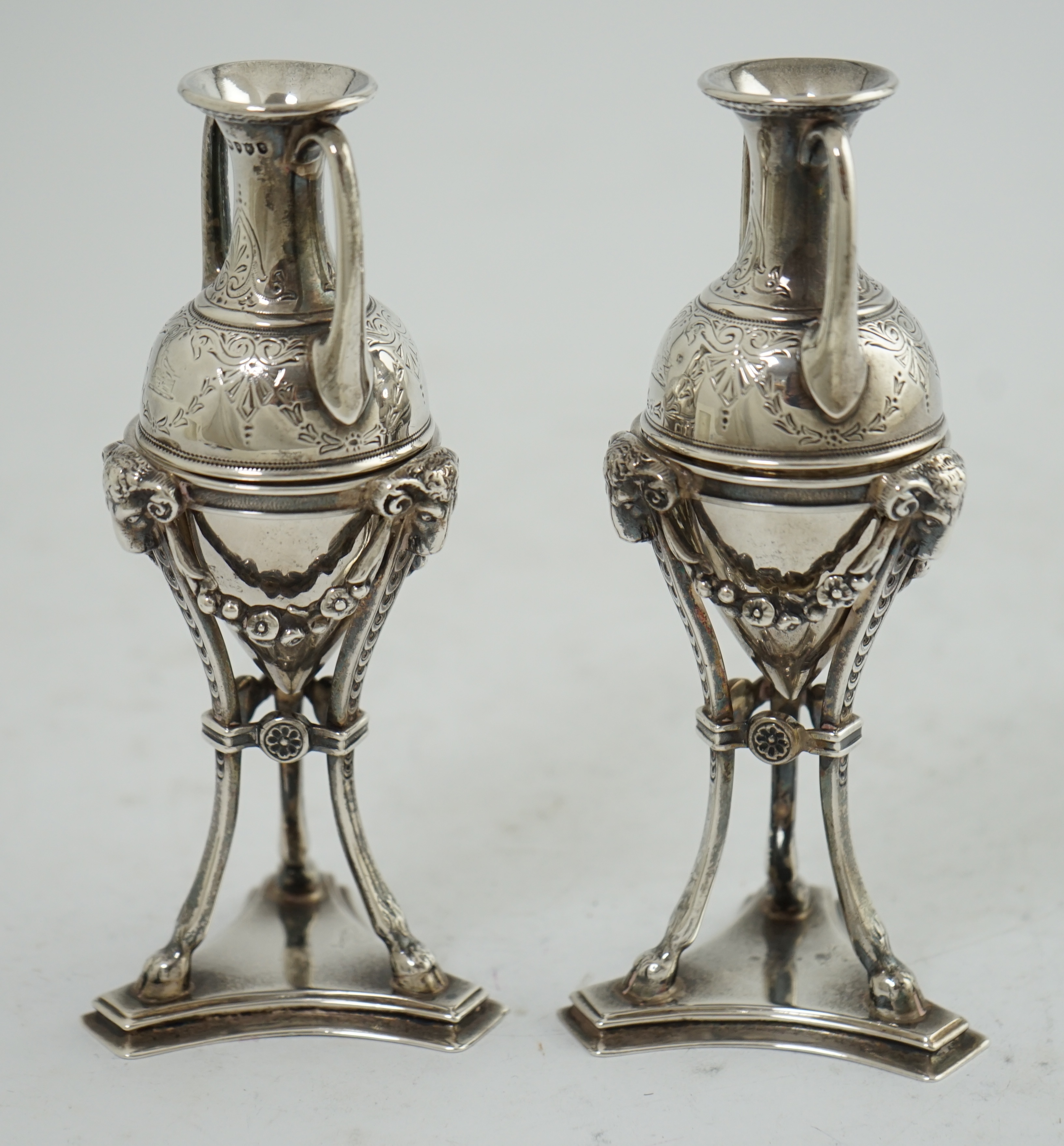 A pair of Victorian silver miniature urns on stands, by William & John Barnard